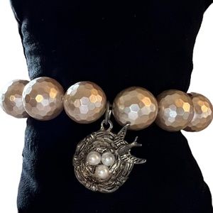 Silver Birds Nest on Faceted Mother of Pearl Beaded Bracelet
